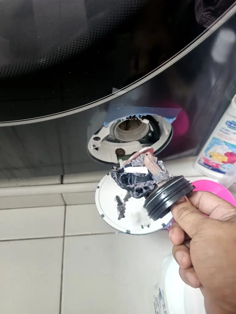 Blocked washing machine drain filter causing drainage problems