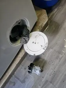 Blocked washing machine drain filter causing drainage problems
